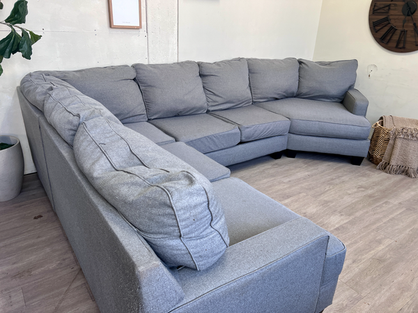 FREE DELIVERY! 🚚 - Jordan’s Furniture Gray Deep-Seated Modern U Sectional Couch with Cuddle Corner