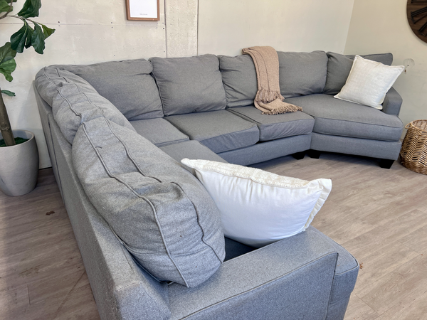 FREE DELIVERY! 🚚 - Jordan’s Furniture Gray Deep-Seated Modern U Sectional Couch with Cuddle Corner